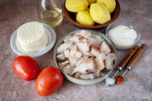 Рыба с картофелем, запеченные под майонезом